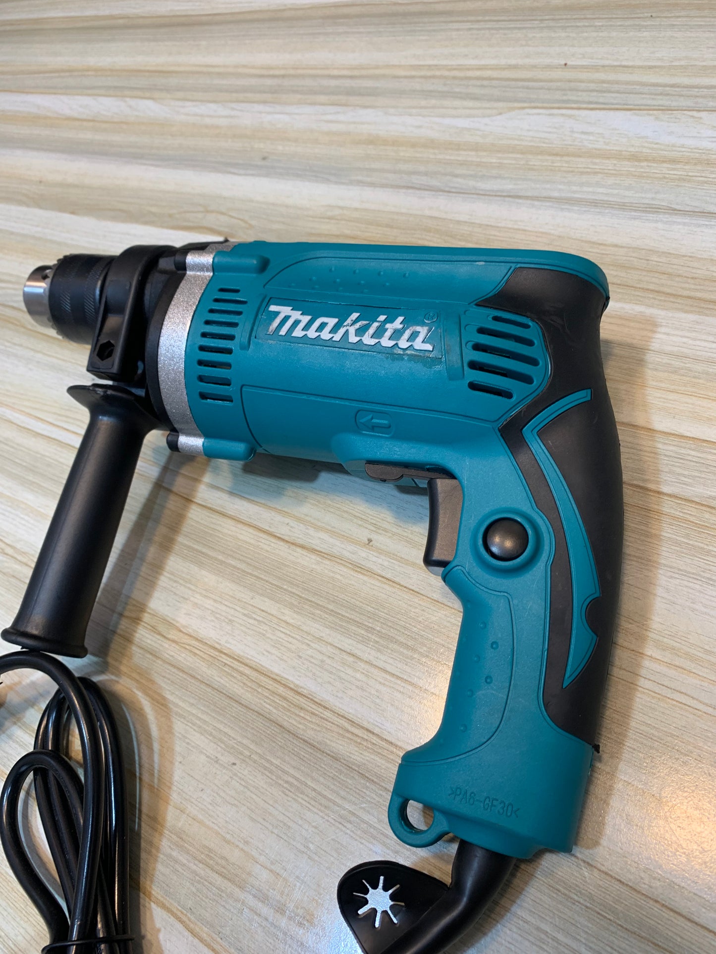 Makita HP1630 Drill with 48,000 RPM for fast, precise drilling in wood, metal, and concrete. Available at Lalaimport.pk.