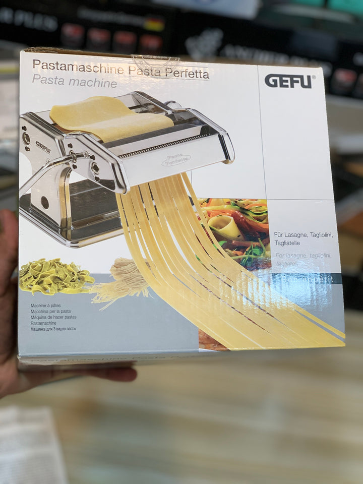 Close-up of GEFU pasta maker creating fettuccine, available at Lalaimport.pk.