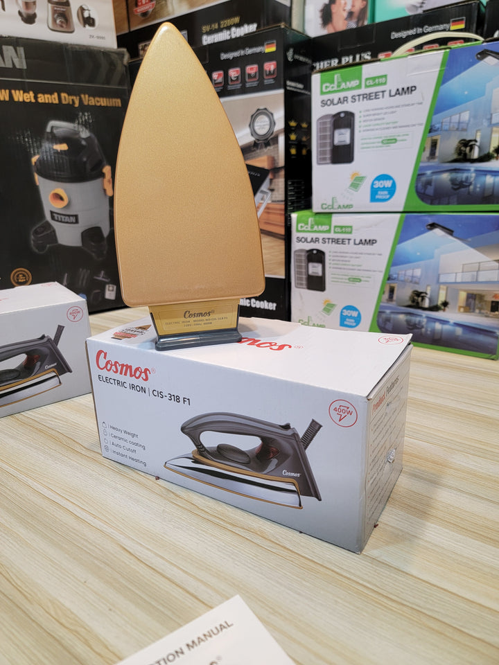 Cosmos CIS-318 F1 Electric Iron with a smooth non-stick soleplate for wrinkle-free clothes.
