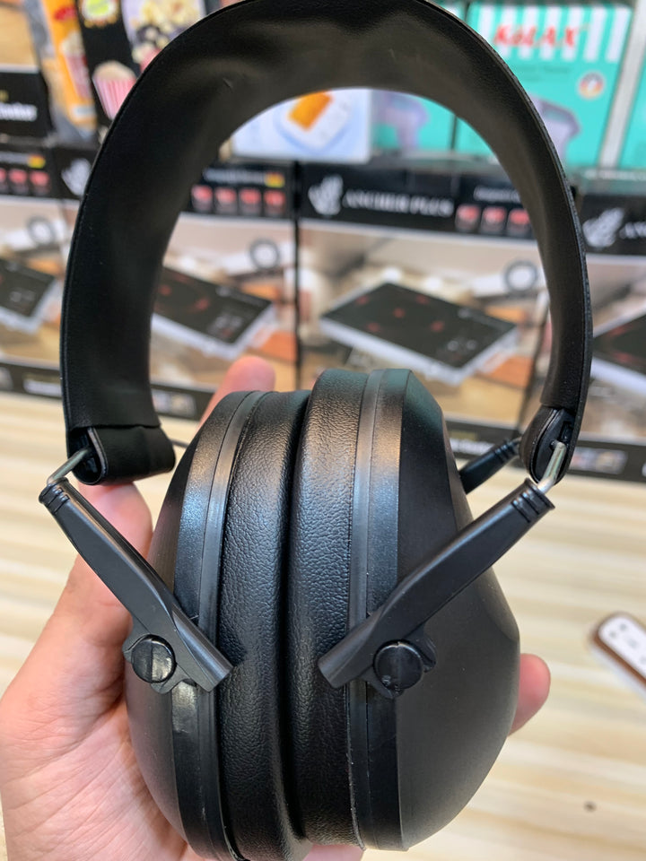 Noise-cancelling ear muffs in use during hunting and tactical activities, ideal for professionals and enthusiasts.