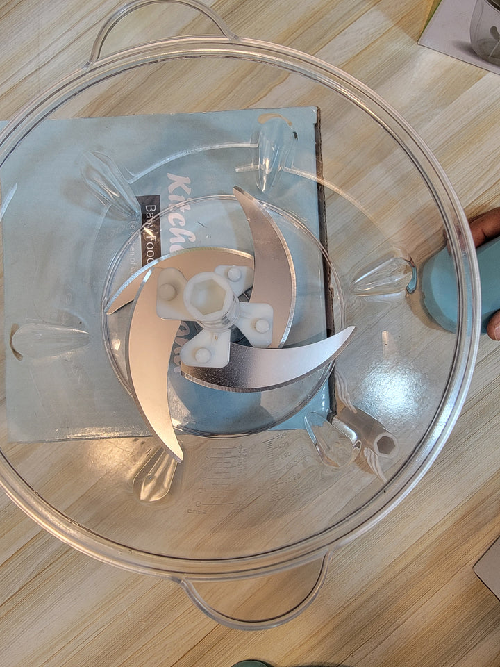 Lassi being made using the 2-liter vegetable cutter and its durable plastic blades, ideal for home use.