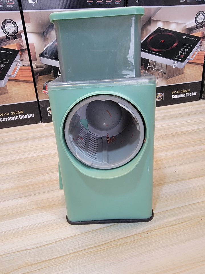 Premium vegetable cutter front view showing stainless steel blades and compact design available at Lalaimport.pk.